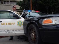 Sheriff's Deputy Rodriguez, an officer from the Los Angeles County Sheriff's Department, guards an intersection outside the Twin Towers Correctional Facility in Los Angeles on Feb. 8, 2013, following reports that murder suspect Christopher Dorner was seen in the area. The correctional facility and adjoining L.A. County Men's Central Jail were on high alert after the report, resulting in area traffic checkpoints conducted by officers in ballistic vests and helmets.