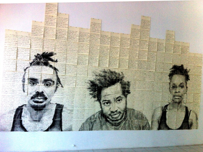 A monumental drawing of three of Kenturah Davis' friends and acquaintances, showing at Papillion Art in Leimert Park in South LA. It's all done by layering words onto the paper. 