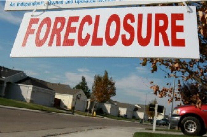 A sign is seen in front of a foreclosed home in Rio Vista, California. 