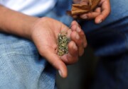 NEW YORK, NY - AUGUST 05: A man prepares to smoke K2 or "Spice", a synthetic marijuana drug, along a street in East Harlem on August 5, 2015 in New York City. New York, along with other cities, is experiencing a deadly epidemic of synthetic marijuana usage including varieties known as K2 or "Spice" which can cause extreme reactions in some users. According to New York's health department, more than 120 people visited an emergency room in the city in just one week in April. While the state banned the ingredients used to make K2 in 2012, distributors have switched to other ingredients and names in an attempt to circumvent the law.  (Photo by Spencer Platt/Getty Images)