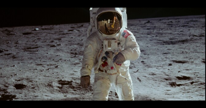 An image of Neil Armstrong and Buzz Aldrin walking on the surface of the moon from NEON's documentary 'Apollo 11'