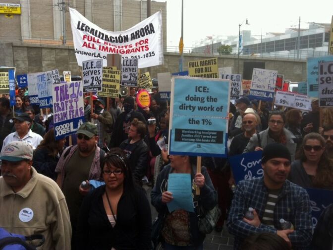 Hundreds protest against immigration policies at the downtown L.A. federal building.