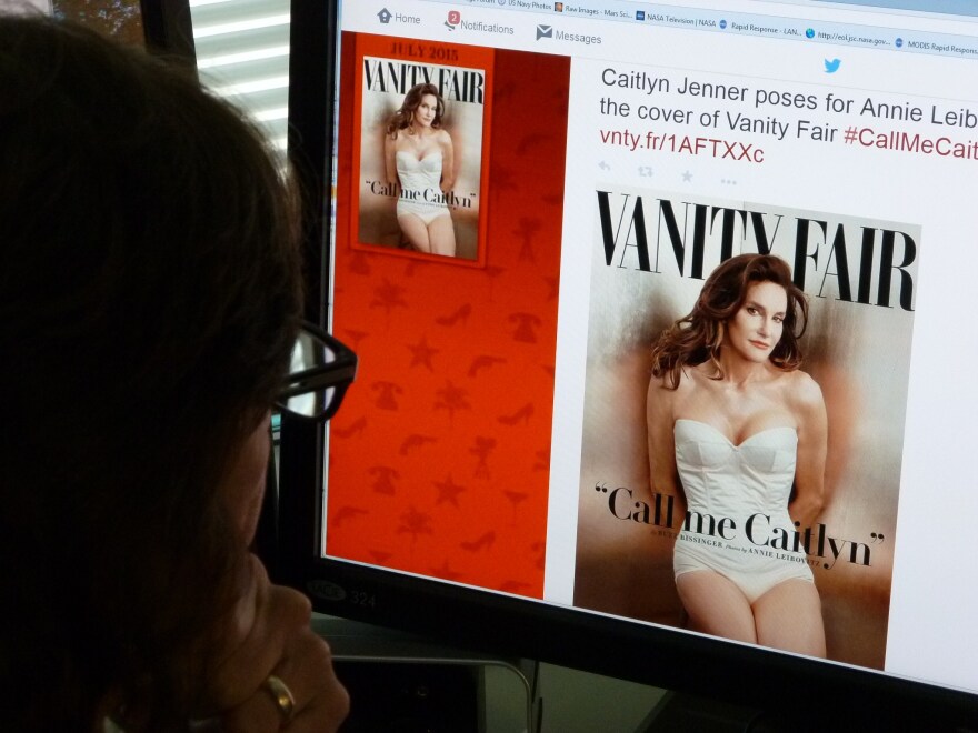 In this June 1, 2015 photo, a journalist looks at Vanity Fair's Twitter site with the Tweet about Caitlyn Jenner, who will be featured on the July cover of the magazine. Caitlyn Jenner, the transgender Olympic champion formerly known as Bruce, on Monday unveiled her new name and look in a sexy Vanity Fair cover shoot -- drawing widespread praise, including from the White House. Lesbian, gay, bisexual and transgender campaigners -- and many well-wishers -- welcomed the high-profile debut, as did the 65-year-old Jenner's family, which includes the media-savvy celebrity Kardashian clan. "I'm so happy after such a long struggle to be living my true self," Jenner wrote in her first tweet after the magazine released the July cover photo by renowned photographer Annie Leibovitz. AFP PHOTO / MLADEN ANTONOV        (Photo credit should read MLADEN ANTONOV/AFP/Getty Images)
