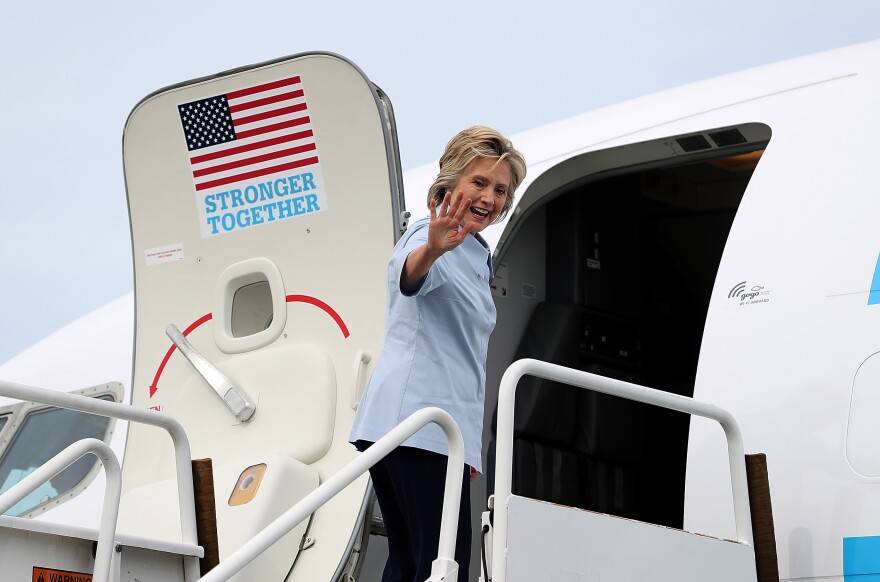 WHITE PLAINS, NY - SEPTEMBER 05:  Democratic presidential nominee former Secretary of State Hillary Clinton waves as she boards her new campaign plane at Westchester County Airport on September 5, 2016 in White Plains, New York. Clinton is kicking off a Labor Day campaign swing to Ohio and Iowa on a new campaign plane large enough to accomodate her traveling press corp.  (Photo by Justin Sullivan/Getty Images)