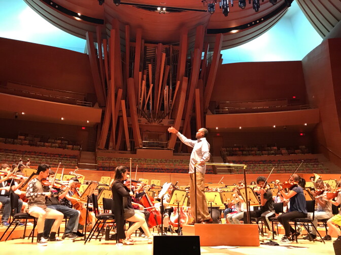Hollywood Bowl principal conductor Thomas Wilkins leads the National Take a Stand Festival Youth Orchestra at the Walt Disney Concert Hall.