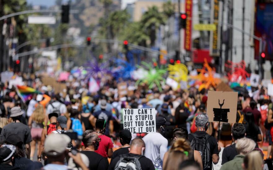 LOS ANGELES, CALIFORNIA  - JUNE 14: Protesters gather on Hollywood Boulevard during the All Black Lives Matter solidarity march, replacing the annual gay pride celebration, as protests continue in the wake of George Floyd’s death on June 14, 2020 in Los Angeles, California. Organizers intend to ‘amplify Black Queer voices and come together in solidarity’ with the march. George Floyd died on May 25th when he was in Minneapolis police custody, sparking nationwide protests. A white police officer, Derek Chauvin, has been charged with second-degree murder, with the three other officers involved facing other charges.  (Photo by Mario Tama/Mario Tama/Getty Images)
