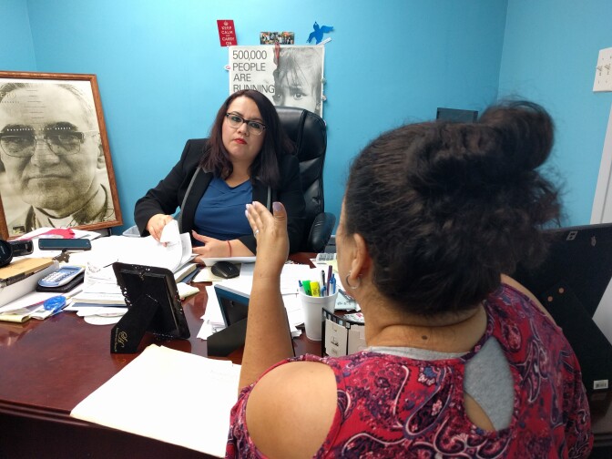 Immigration lawyer Yanci Montes advises a client at El Rescate, a non-profit that provides free legal services to immigrants in Pico-Union.