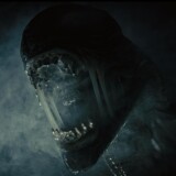 Alien creature opens its mouth surrounded by smoke