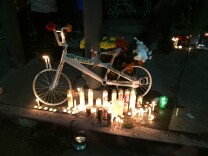 A ghost bike marks the spot on North Figueroa Street where 31-year-old Jose Luna was killed while riding his bike in a hit and run crash on June 26, 2015.