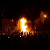 MINNEAPOLIS, MN - MAY 28: Protesters cheer as the Third Police Precinct burns behind them on May 28, 2020 in Minneapolis, Minnesota. As unrest continues after the death of George Floyd, police abandoned the precinct building, allowing protesters to set fire to it. (Photo by Stephen Maturen/Getty Images)