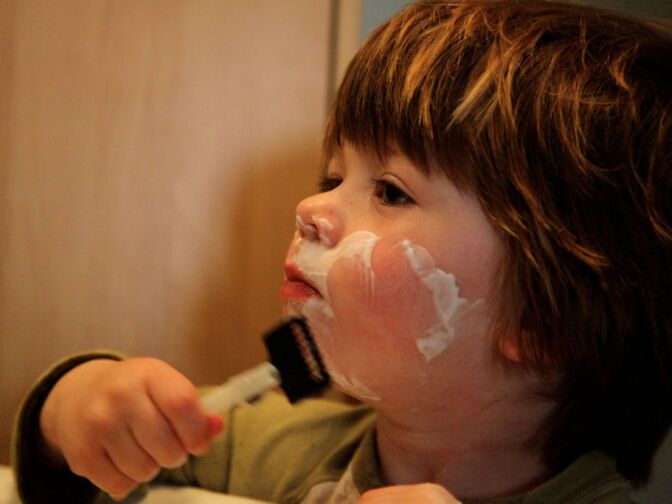 Sawyer shaving in February of this year, at two-and-a-half years old.