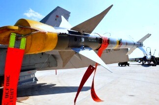 A rocket is setup on Canadian F18 jet fighters from the 425 Tactical Fighter squadron of 3 Wing Bagotville Quebec leaving for a mission on March 24, 2011 at Trapani-Birgi airbase in Sicily.
