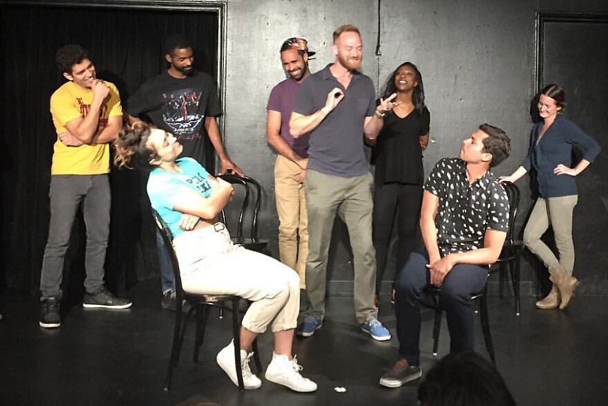 The improv group Improvisos Peligrosos performs on the UCB stage.