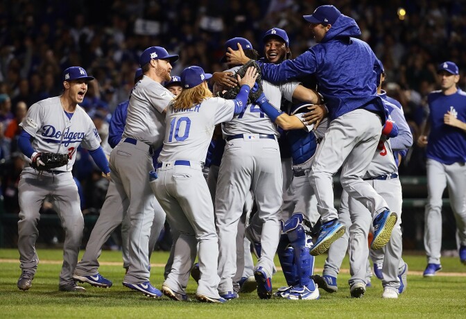 CHICAGO, IL - OCTOBER 19:  The Los Angeles Dodgers celebrate defeating the Chicago Cubs 11-1 in game five of the National League Championship Series at Wrigley Field on October 19, 2017 in Chicago, Illinois. The Dodgers advance to the 2017 World Series.  (Photo by Jonathan Daniel/Getty Images)