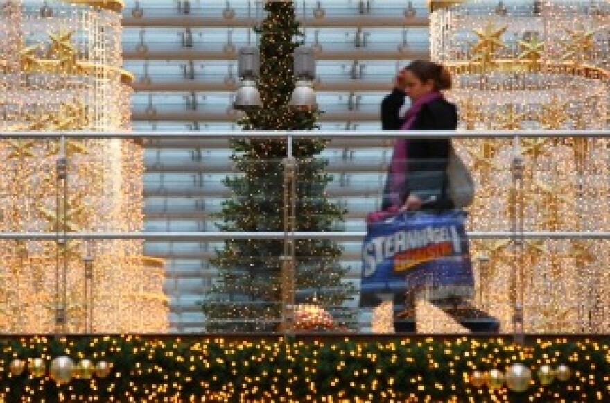 A woman carries shopping bags through a shopping mall on November 22, 2010 in Berlin, Germany.