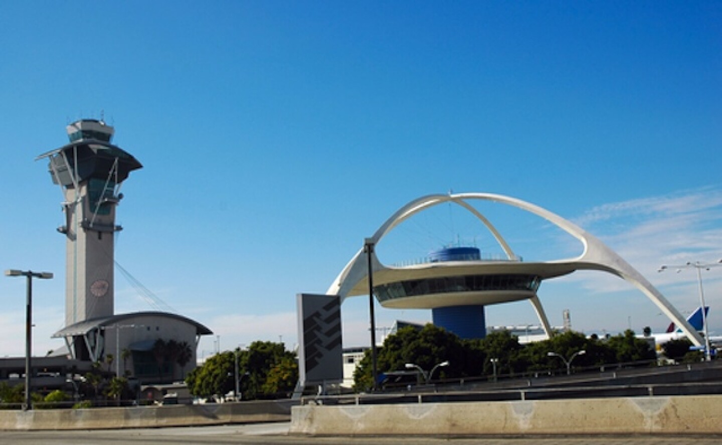 An image of the control tower and the space-age Theme Building at LA International Airport