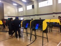 Voters try out touch-screen balloting during a mock election  at Salazar Park in East LA on Sept. 28, 2019.