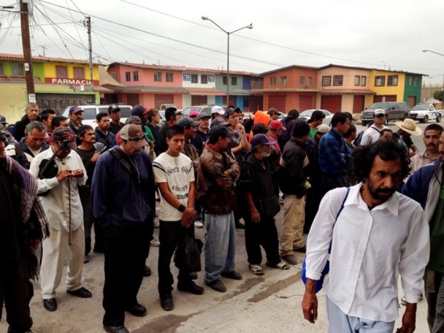 Deportees form up outside a Tijuana breakfast hall, where many will have their only substantive meal of the day.