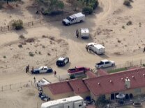 Police reportedly removed several dogs and two men from a home in Antelope Valley where a woman was fatally mauled Thursday morning.