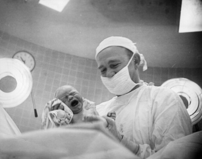 Los Angeles Daily News photographer Helen Brush Jenkins photographs her newborn baby. As a female news photographer, Brush Jenkins was a pioneering presence at the old Los Angeles Daily News beginning in the early 1940s when she was hired because so many cameramen were away at war. 