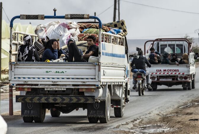 Syrians flee  with their belongings the countryside of the northeastern Syrian town of Ras al-Ain on the Turkish border, toward the west to the town of Tal Tamr on October 19, 2019. - Turkey's President Recep Tayyip Erdogan fired off a fresh warning today to "crush" Kurdish forces as both sides traded accusations of violating a US-brokered truce deal in northeastern Syria. (Photo by Delil SOULEIMAN / AFP) (Photo by DELIL SOULEIMAN/AFP via Getty Images)