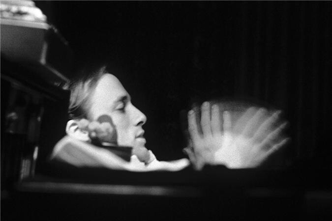 Stills of Crosby, Stills and Nash, waving. 