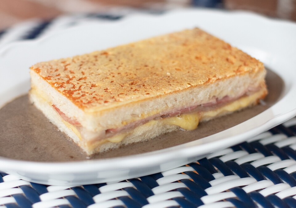 a fancy looking grilled cheese sandwich with the sides cut