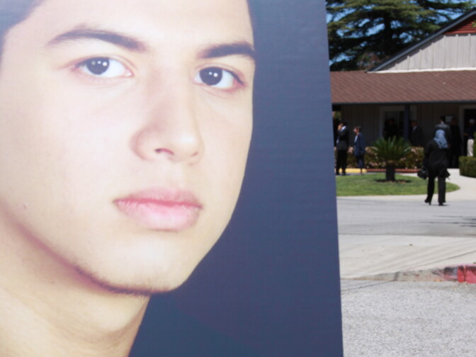 Photo of 19 year old Abdul Arian stands outside his memorial service at Valhalla Memorial Park. Arian was shot to death by LAPD after he led them on a high speed chase and reportedly told 911 he was armed. 
