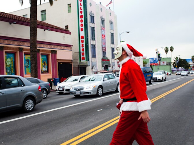 An "Anonymous" merry maker brings the Occupy spirit to SantaCon.