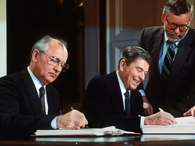 Soviet leader Mikhail Gorbatchev (L) and US President Ronald Reagan sign 08 December 1987 at the Washington summit a treaty eliminating US and Soviet intermediate-range and shorter-range nuke missiles.   AFP PHOTO / AFP / -        (Photo credit should read -/AFP/Getty Images)