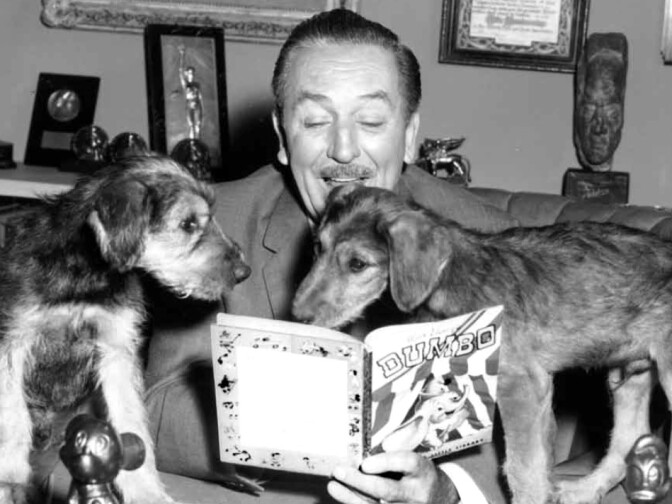 Walt Disney reading aloud from an early Golden Book. Or trying to.