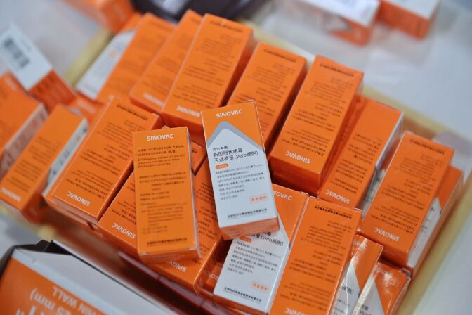 Boxes of Sinovac's Covid-19 coronavirus CoronaVac vaccine are pictured during a vaccination drive at Bang Sue Central Station in Bangkok on May 24, 2021. (Photo by Lillian SUWANRUMPHA / AFP) (Photo by LILLIAN SUWANRUMPHA/AFP via Getty Images)
