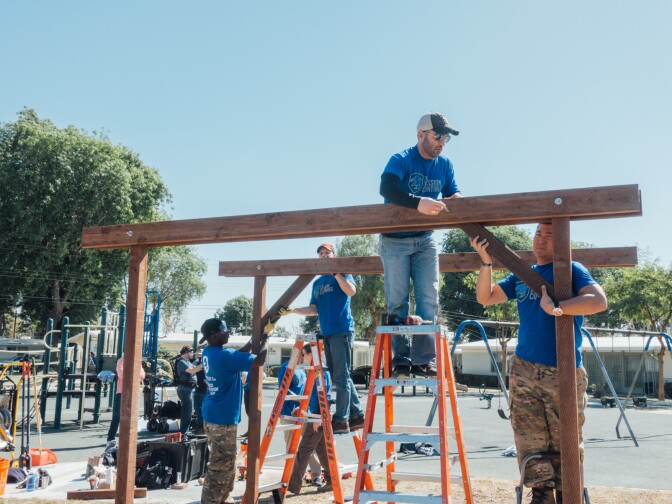 Kids playing at Gonzaque Village in Watts will have a new shade structure thanks to volunteers with The Mission Continues, a military veteran service organization.