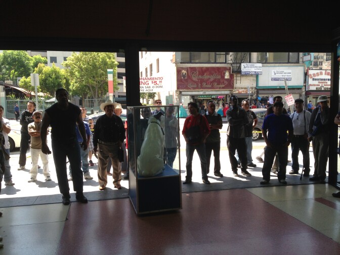 Fans of the Mexican national team watch Sunday's World Cup match against the Netherlands outside a downtown L.A. store. The owner had set up a television facing the street.