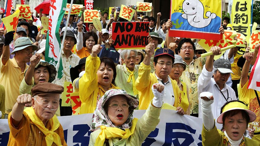 Okinawans protest May 23 in front of the local government office in the city of Naha against the U.S. Marine base on the island.