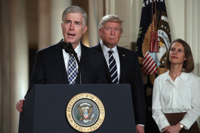 File:  Judge Neil Gorsuch delivers brief remarks after being nominated by U.S. President Donald Trump to the Supreme Court with his wife Marie Louise Gorshuch during a ceremony in the East Room of the White House January 31, 2017 in Washington, DC.