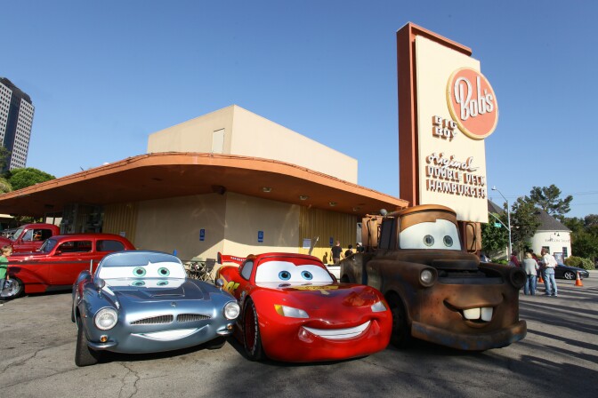 BURBANK, CA - JUNE 17: In this handout photo provided by Disney and Pixar, (L-R) British spy Finn McMissile, four-time Piston Cup champion Lightning McQueen and his best pal Mater (life-size remote controlled models based on the characters) from Disney and Pixar's "Cars 2" roll into Bob's Big Boy for a pit stop on June 17, 2011 in Burbank, California. (Photo by Patrick Wymore/Disney Parks via Getty Images)