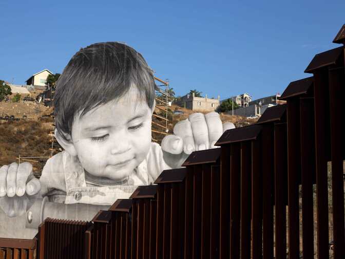View of an artwork by French artist JR on the US-Mexico border in Tecate, California, United States on September 6, 2017.
