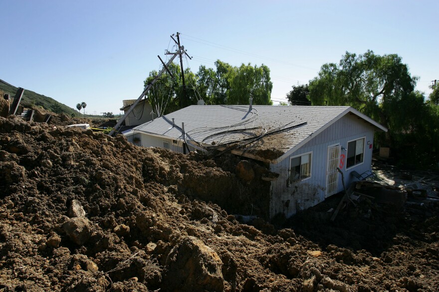 LA CONCHITA, CA - JANUARY 14:  A home damaged in the deadly mudslide that killed at least 10 people is one of those that residents will not be allowed to enter on the first day that evacuated residents are allowed to return to their devastated community January 14, 2005 in La Conchita, California. With at least three people still missing, rescuers suspended search efforts after the hillside above shifted, raising concern that another mudslide could occur. 15 homes were destroyed and 16 damaged when the mudslide poured over part of the small seaside town of 260 people at the end of the area's heaviest rainfall in a 15-day period since records began in 1921.     (Photo by David McNew/Getty Images)