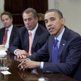 US President Barack Obama speaks before Speaker John Boehner (R-OH) Secretary of the Treasury Timothy Geithner (3rdR) and other cabinet members during a meeting on November 16, 2012 in Washington,DC. Obama said Friday that Democrats and Republicans needed to make 'tough compromises' in order to overcome divisions over deficit reduction and avoid the fiscal cliff.