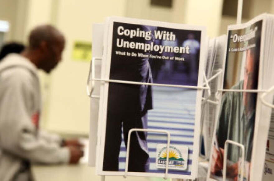 Pamphlets with information about unemployment are displayed at Eastbay Works Oakland One-Stop Career Center in Oakland, California