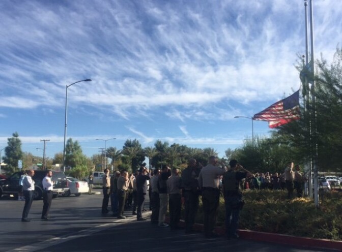 Los Angeles County Sheriff's Deputies salute Antelope Valley Hospital's lowering of the U.S. flag to half-staff on Wednesday, Oct. 5, 2016, in honor of sheriff's  Sgt. Steve Owen, who died at the hospital after being shot earlier in the day by a suspected burglar.