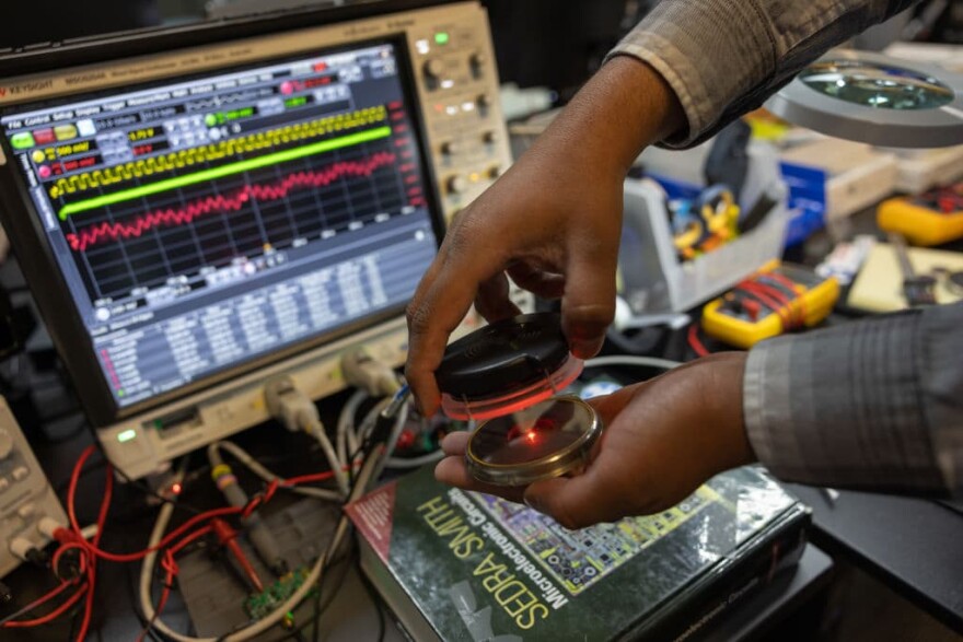 Aamir Ahmed Khan, PhD, Principal Electrical Engineer for Paradromics, works on the Transceiver which connects to the brain implants. The device is wirelessly powered and does not have a battery to charge. 
(Photo by Julia Robinson for The Washington Post via Getty Images)