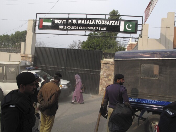 Police stand guard after students at Saidu Sharif College in Swat protested against a decision to rename the school after Malala Yousufzai, on Dec. 12, 2012. Angry students boycotted classes and tore up posters of teenage activist.
