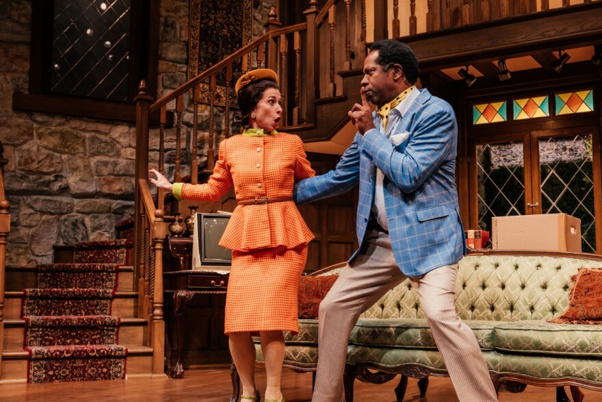 Two actors, Audrey Francis and James Vincent Meredith, perform in character in a stage production of "Noises Off." Audrey is gasping in shock as James shushes her.
