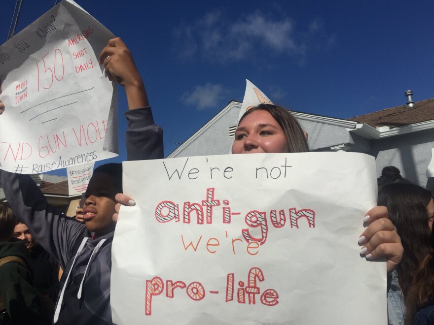 Palms Middle School student Hazel Holmes walked out at 10 a.m. Wednesday, March 14, 2018 with hundreds of her classmates to protest gun violence a month after 17 people were killed in a school shooting in Parkland, Florida.