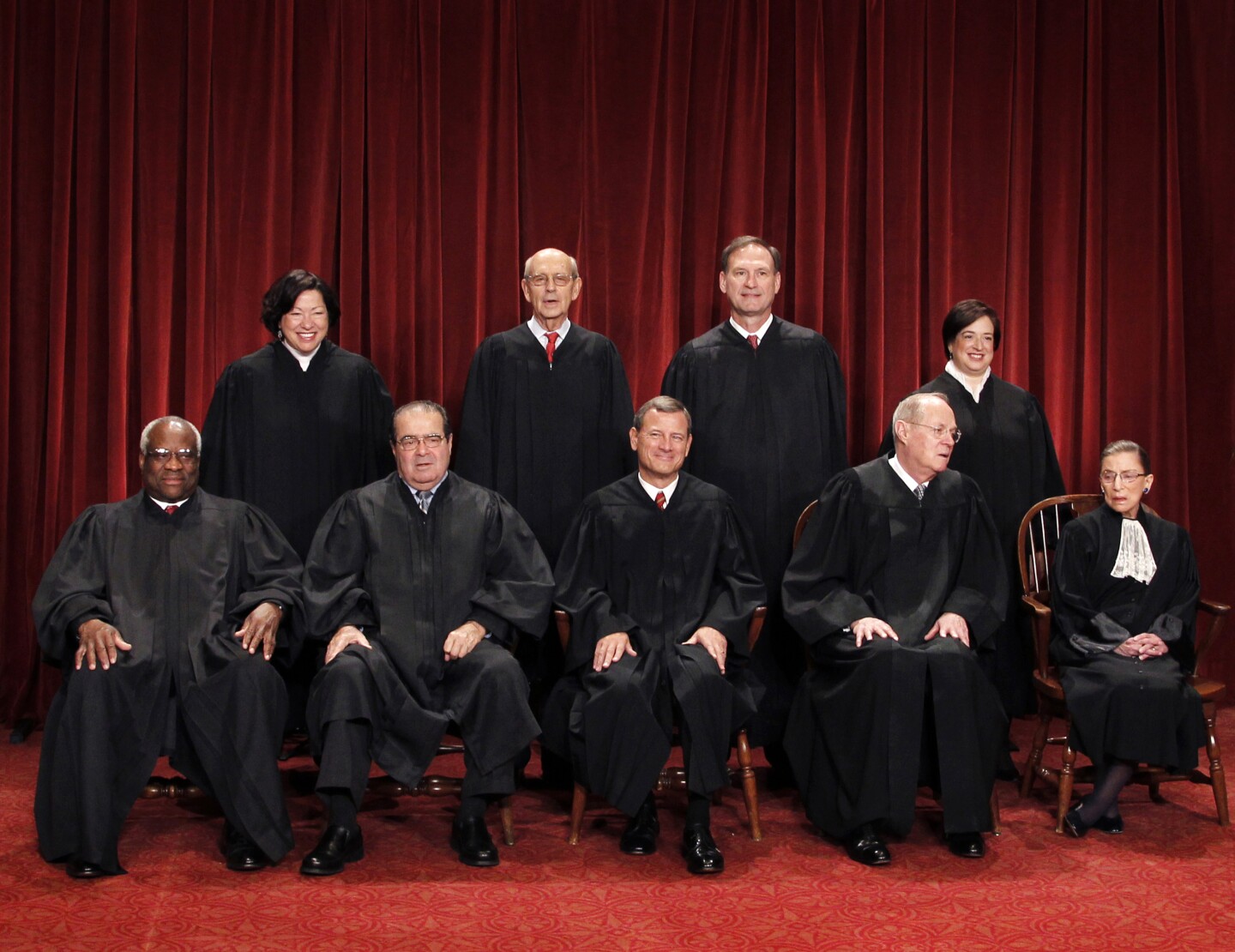 The Supreme Court justices pose for a group photo at the Supreme Court in Washington in 2010. Seated, from left, are Justice Clarence Thomas, Justice Antonin Scalia, Chief Justice John Roberts, Justice Anthony Kennedy, and Justice Ruth Bader Ginsburg. Standing, from left, are Justices Sonia Sotomayor, Stephen Breyer, Samuel Alito Jr., and Elena Kagan.