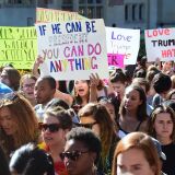 University of California Loas Angeles students march through campus on November 10, 2016 in Los Angeles, California, during a "Love Trumps Hate" rally in reaction to President-elect Donald Trump's victory in the presidential elections.  / AFP        (Photo credit should read /AFP/Getty Images)