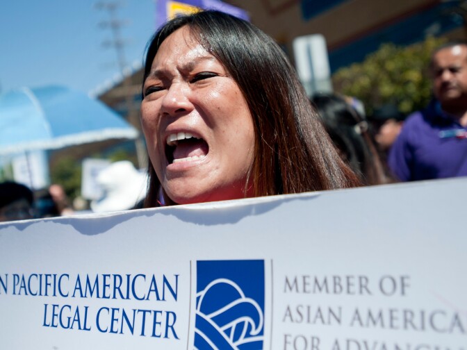 Betty Hung, policy director for the Asian Pacific American Legal Center chants at the Westwood Recreation Center. Hundreds of immigration reform supporters took part in a march on Wednesday to Senator Diane Feinstein's LA office. The march coincides with a immigration reform rally in Washington D.C.