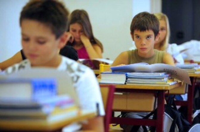 File photo: Pupils listen to their teacher in a classroom on the first day of the school year. 
